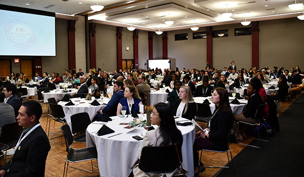 Conference room filled with people watching a presentation
